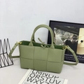 Avocado green woven leather tote bag with large grid pattern and adjustable strap - Travertine Green