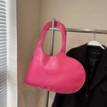 Pink heart-shaped shoulder bag with crocodile pattern texture on a hanger - Pink