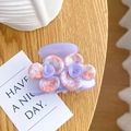 Elegant purple camellia hair clip with orange-pink patterns on a wooden table - 6cm / Purple