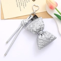Quilted silver bow keychain with heart metal clasp and sleek lanyard on neutral background - Silver