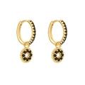 Détail de boucles d'oreilles huggie dorées avec oxydes de zirconium noirs pavés - Fleur Or Noir