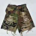 Detail of camouflage denim shorts with distressed ripped holes and frayed raw hem edges - S / Camouflage