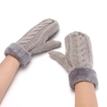 Detailed view of grey cable knit fingerless gloves with thick plush fur cuffs on wrist - Light Gray