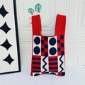 Knit tote bag with red, white and blue geometric patterns and wide shoulder straps - Red Background With Blue Dots