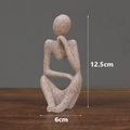 Beige resin thinker sculpture in abstract style with 12.5cm height and 6cm width - Sandstone Thinking Left