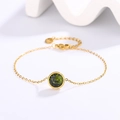 Elegant 18k gold plated stainless steel bracelet featuring a round emerald green gemstone - Gold + Olive Green Zirconia