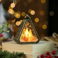 Detail of bronze Christmas lantern featuring Santa landscape and warm LED lighting - Santa Claus Sleigh / Bronze