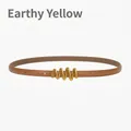 Slim tan leather belt for women with a stylish golden wavy metal buckle detail - Earthy Yellow