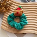 Green velvet Christmas scrunchie with brown reindeer plush ornament on a wooden tray - Green Elk