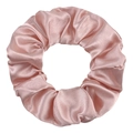 Detail of pink satin scrunchie showing smooth silk texture and elastic pleated design - Soft Pink