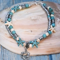 Multilayer anklet with turquoise beads, starfish and dolphin charms for beach vacation - Three Dolphins