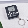 Classic black mini handheld game player keychain with white buttons on white background - Deep Black