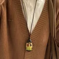 Collier ethnique avec boutons colorés et gland vert sur une cordelette marron - 5# Collier-Café-Style Gland Vert Bouton Vintage