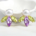 Luxury gold drop earrings with white pearl and colorful crystals on marble background - Yellow Green Purple