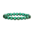 Macro shot of dark green faceted crystal beads showing light refraction and texture - Green