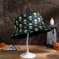 Detail of black bucket hat with neon green skull print and Halloween festive decorations - M (56-58cm) / Green Skull