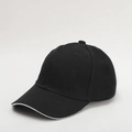 Detail view of the black baseball cap showing the twill fabric texture and white edge line - Adjustable / Black With White Trim