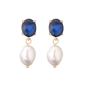 Detail of elegant gold earrings featuring oval blue gemstones and baroque pearls - Dark Blue