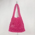 Detailed close-up of rose pink crochet net beach bag featuring a large mesh diamond pattern - Rose Red