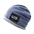 Detail of blue cotton knit beanie featuring a black 'FIGHTING!' woven label and cuff - Lake Blue