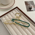 Safety pin style hair claw clip in gold finish with cream and dark green enamel - Enamel Safety Pin Style (HH4000)