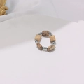 Detailed close-up of handmade elastic bead ring with brown ink stone and silver metal beads - Steel Picture Jasper