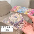 Squishy stress relief toy in purple and white silicone with colorful glitter and beads - Cake Purple
