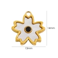 Macro detail of 13mm by 14mm white shell flower pendant with 14k gold plating - Black Zirconia