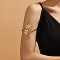 Elegant gold spiral arm cuff featuring matte flower design with white zircon stones - Gold Flower