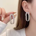 Elegant silver oval stud earrings featuring white pearls and rows of sparkling rhinestones - Vintage Oval Pearl Rhinestone Spliced Studs