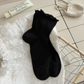 Chaussettes noires en tricot avec bords à volants et texture à côtes verticales élégantes - Taille unique / Noir