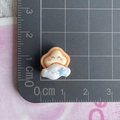 Mini yellow star and white cloud resin charm with size measurement on a grid mat - Cloud Covering Star