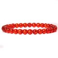 Detailed view of 6mm red agate beads featuring engraved golden Sanskrit characters - Red Mantra Stone