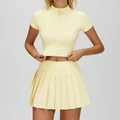 Slim fit cream yellow yoga set with half-zip short sleeve top and pleated tennis skirt - S / Top And Bottom / Creamy Yellow