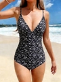 Slim-fit one-piece swimsuit featuring black floral patterns and elegant deep V-neckline - S / Black Floral