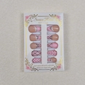 Detail of almond nails featuring pink lace, black bows, and elegant quilted patterns - Pink Sweet Bowknot Argyle Style (WY-044) / 24 Pieces Per Box