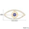 Evil eye rhinestone brooch in gold plating with blue crystals measuring 5.9cm - Gold Eye (White Blue)