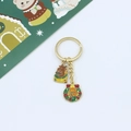 Detailed view of Christmas keychain with enamel reindeer and gingerbread man charms - Christmas Reindeer & Gingerbread Wreath