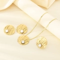 Detail of gold-plated stainless steel jewelry set featuring white pearls and textured finish - Textured Disc Pearl Style (KS225379-LX)