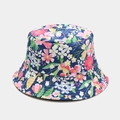 Detailed view of dark blue floral reversible bucket hat with pink and yellow flower prints - Double-sided Floral Navy Blue / Navy Blue