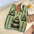 Detailed close-up of a green and black knitted tote bag with geometric tree patterns - Spring Bamboo Green