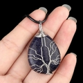 Blue sandstone teardrop pendant with silver wire-wrapped tree of life on black cord - Blue Goldstone (Synthetic)