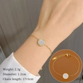 Bracciale in acciaio al titanio dorato con ciondolo a cuore in pavé di cristalli - Oro
