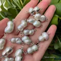 Peanut-shaped baroque pearl pendant with silver-plated rim and double jump rings - No.13 Width 9-12mm