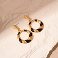 Detail of vintage round earrings with gold twisted metal and black enamel on stone texture - Black Enamel Twisted Round / Black (Silver Earring Post)