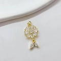 Detailed close-up of a sparkling gold daisy pendant with clear zircon flower petals - White