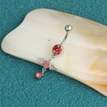 Stainless steel belly ring featuring a red crystal and pink heart pendant with wings - Default