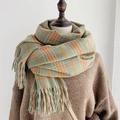 Classic green and orange plaid cashmere scarf with soft tassels on mannequin - Green