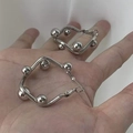Modern silver geometric hoop earrings with spherical accents held by hand - 51# Geometric With Spherical Decoration Silver Earring (HE13011)
