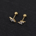 Macro detail of golden lightning bolt earring with sparkling cubic zirconia inlay and screw back - Lightning - Gold